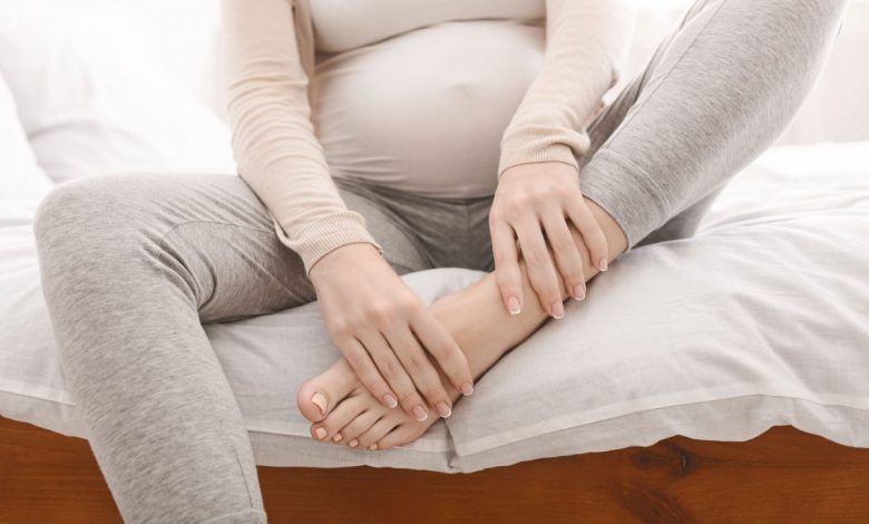 What is the symptom of postpartum edema and how is